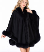 Model wearing the CA50 black cashmere cape with black fox fur trim