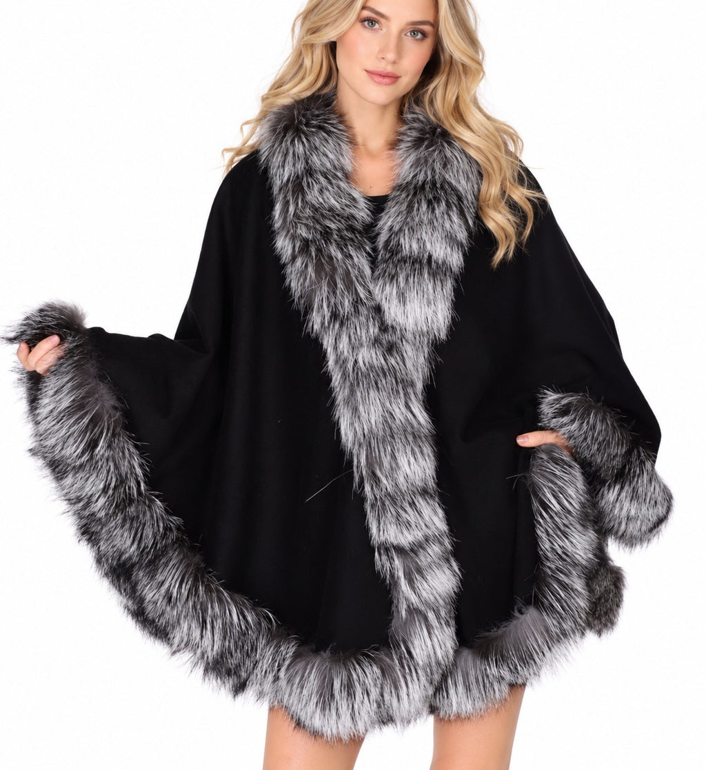 Model wearing the CA50 black cashmere cape with silver fox fur trim
