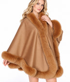 Model wearing the CA50 camel cashmere cape with fox fur trim