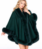 Model wearing the CA50 emerald green cashmere cape with fox fur trim