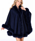 Model wearing the CA50 navy cashmere cape with fox fur trim