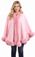 Model wearing the CA50 pink cashmere cape with fox fur trim