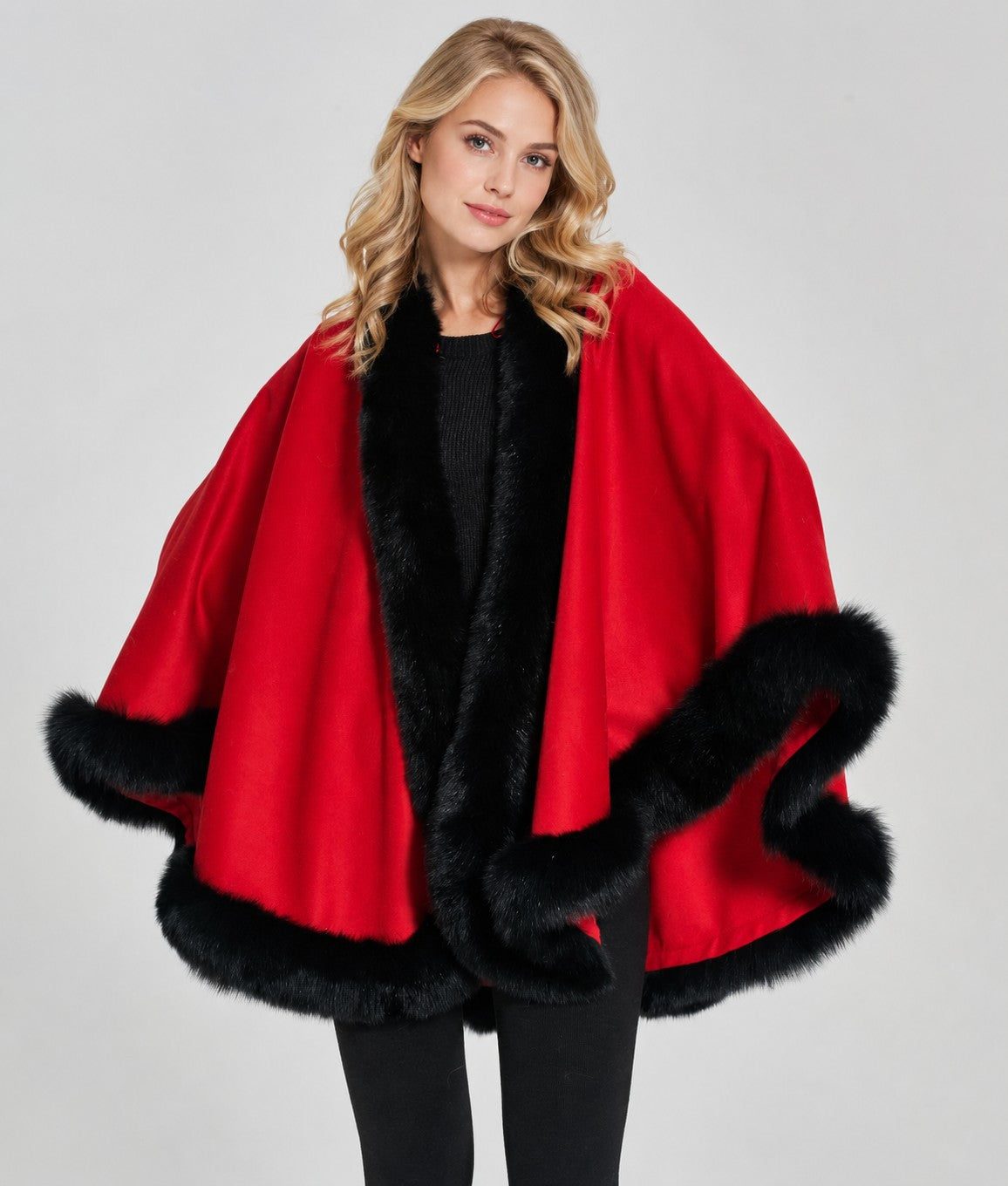Model wearing the CA50 red cashmere cape with black fox fur trim